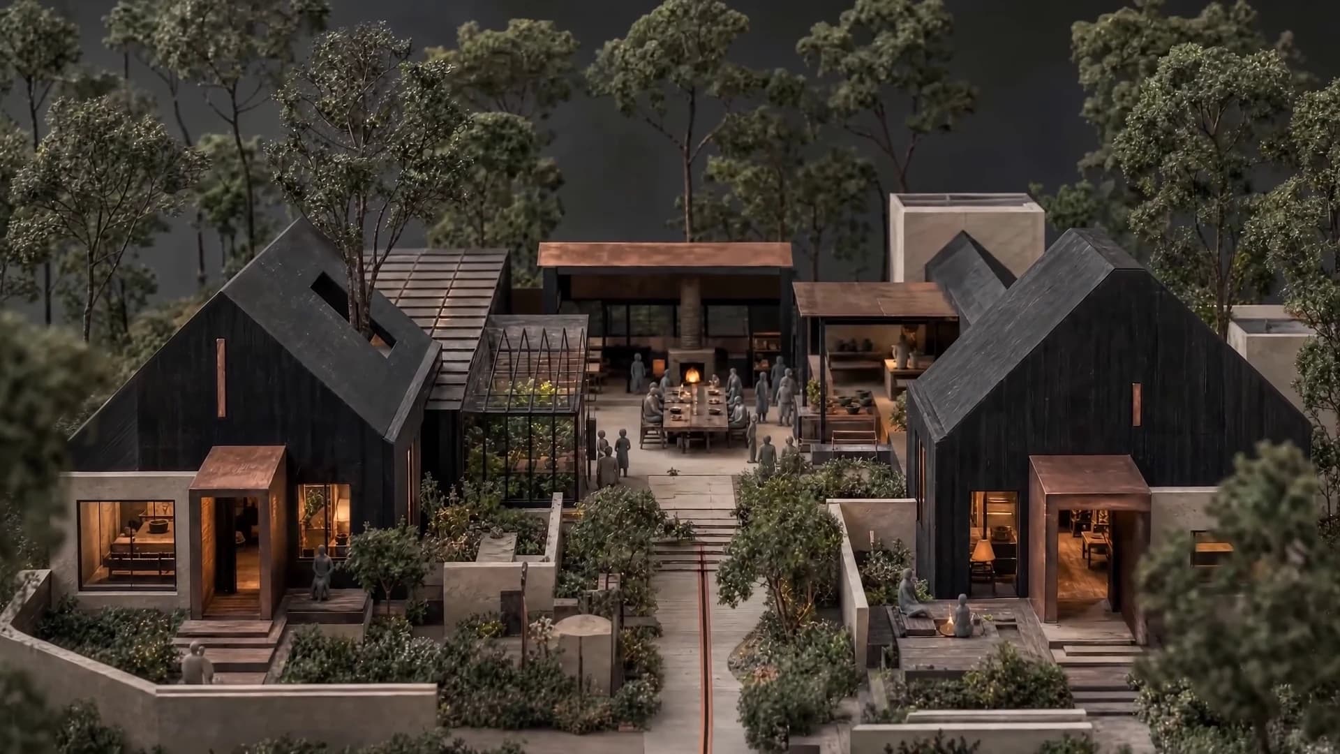 An architectural model of private homes gathered around gardens, a greenhouse and a shared table